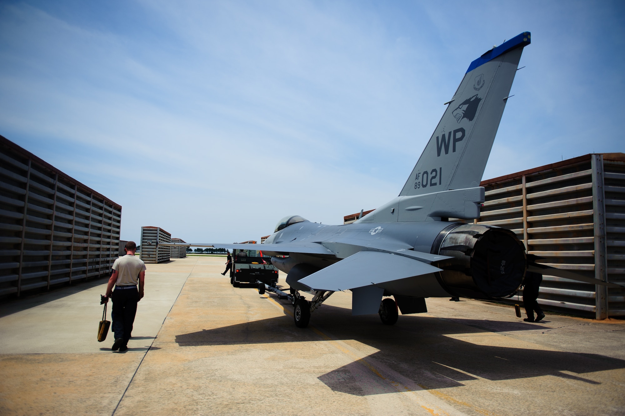 Crew chiefs take an F-16 Fighting Falcon back to the flight line after a full paint job at Kunsan Air Base, Republic of Korea, June 16, 2014. Airmen from the 8th Maintenance Squadron corrosion control section completed the first in-house paint job at Kunsan in more than six years after a recent upgrade to the painting facility. (U.S. Air Force photo by Senior Airman Armando A. Schwier-Morales/Released)