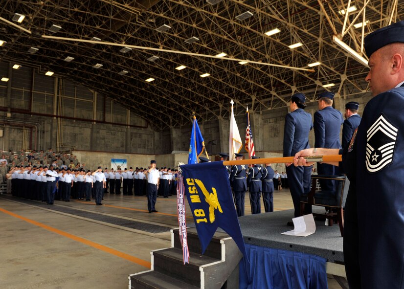 Members of the 18th Mission Support Group salute during a change of command ceremony on Kadena Air Base, Japan, June 18, 2014, during which Col. Debra Lovette took command of the group. The 18th MSG provides combat support for Pacific Air Forces' largest installation with 18th Wing and associate units, $6 billion in assets and more than 12,500 acres of land. (U.S. Air Force photo by Naoto Anazawa) 