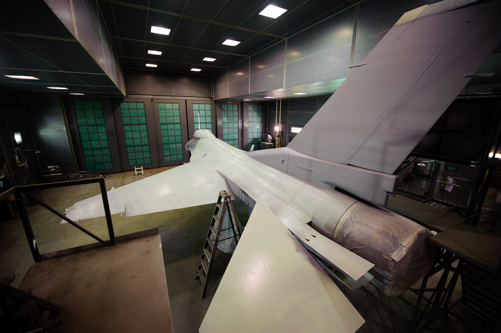 F-16 Fighting Falcon 89-021 cures after receiving its first coat of paint during a large scale paint job at Kunsan Air Base, Republic of Korea, June 6, 2014. Airmen from the 8th Maintenance Squadron corrosion control section conducted the first depot-level paint job at Kunsan in 8 years after a recent upgrade to their facility. (U.S. Air Force photo by Senior Airman Armando A. Schwier-Morales/Released)