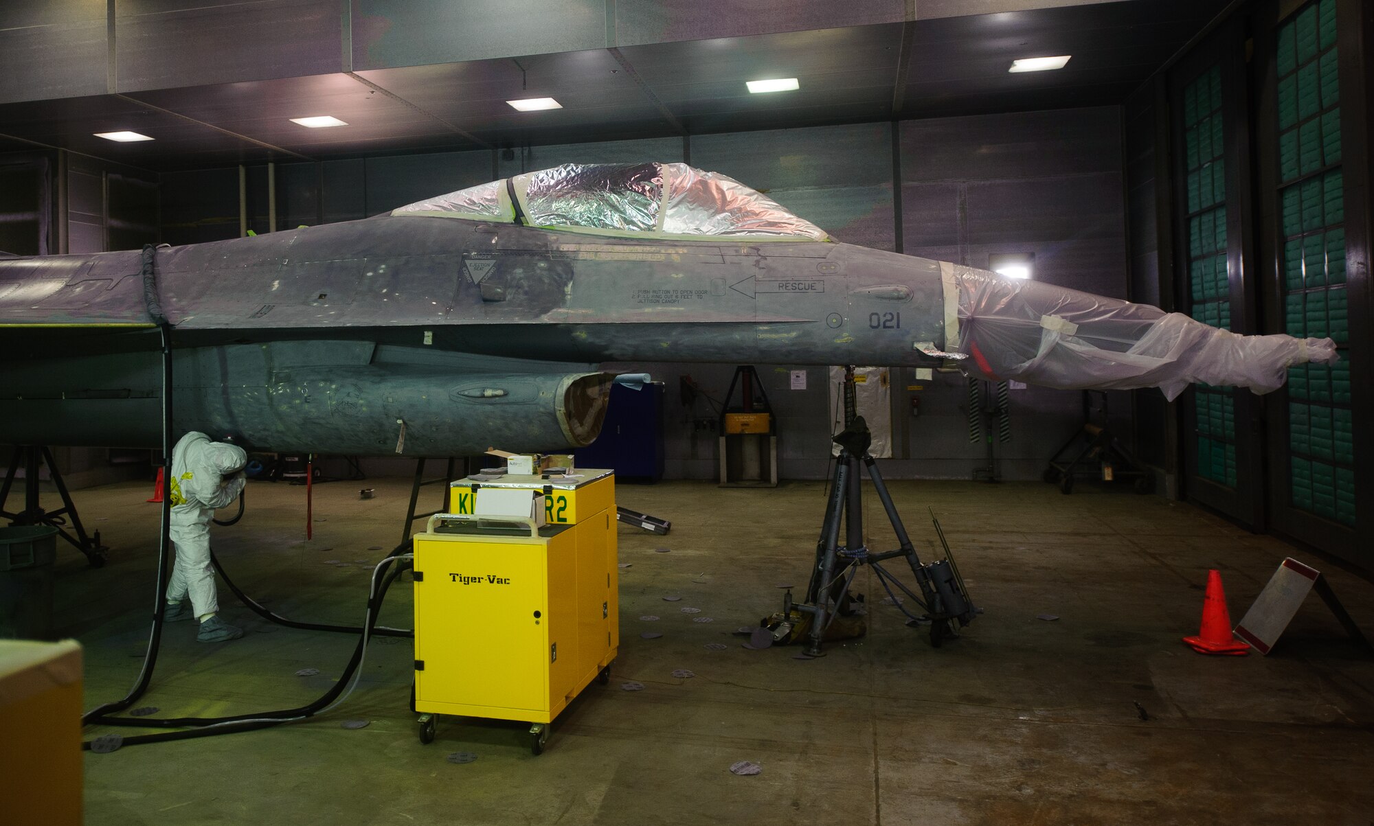 Airmen from the 8th Maintenance Squadron corrosion control section begin sanding down and preparing an F-16 Fighting Falcon for a full depot-level paint job at Kunsan Air Base, Republic of Korea, June 4, 2014. Recently an overhaul was completed on the corrosion shop hanger. This allowed the shop to complete a paint job expected to take 14 days in a depot in 10 days. (U.S. Air Force photo by Senior Airman Armando A. Schwier-Morales/Released)