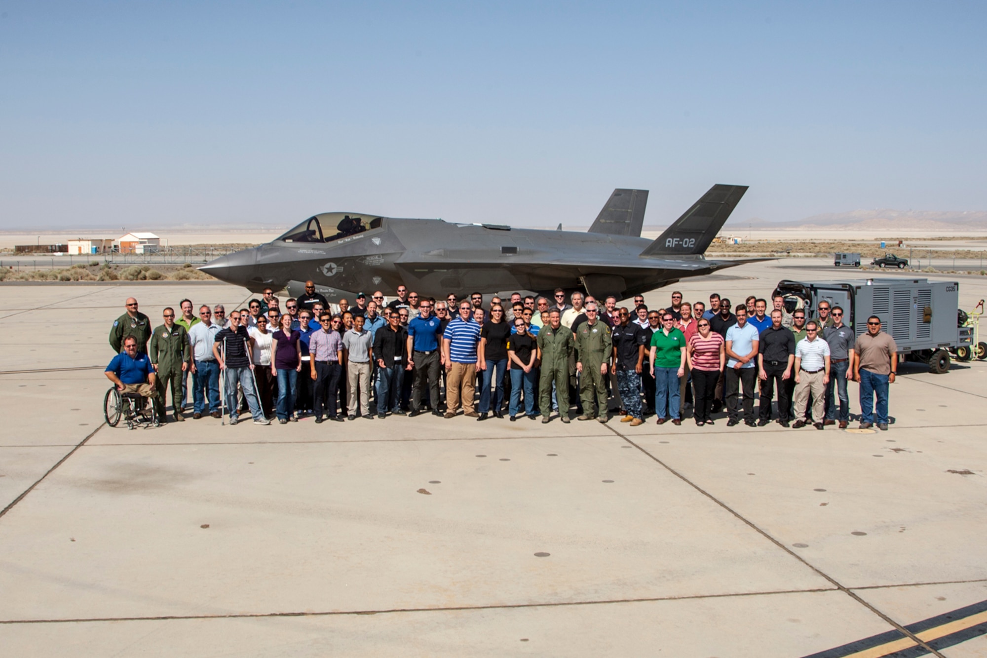 Members of Edwards AFB's F-35 Integrated Test Force pose in front of AF-2 June 11; the day the Lightning II became the first F-35 to reach 1,000 flying hours. (Photo courtesy of Darin Russell/ Lockheed Martin)
