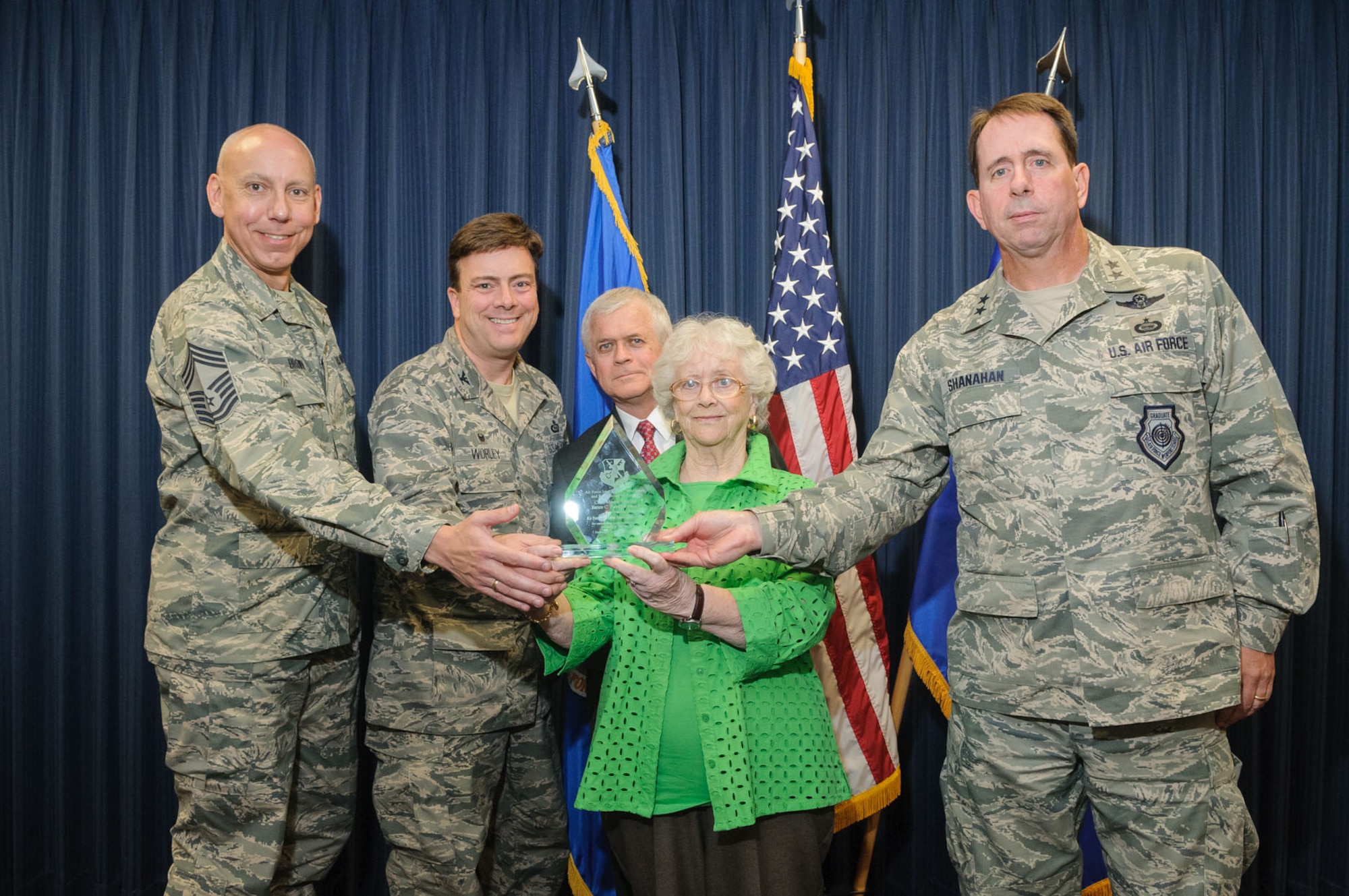 Col. Christopher Worley, Air Force Technical Applications Center commander, second from left, and AFTAC Superintendent Chief Master Sgt. Matthew Brown, accept the 40th anniversary Chief Master Sergeant James C. Swindell Award June 18 from Air Force Intelligence, Surveillance and Reconnaissance Agency Commander, Maj. Gen. John Shanahan, Chief Swindell's wife June and her son Clay. The award is presented annually for outstanding communication and information operations systems support. (U. S. Air Force photo by William Belcher)     