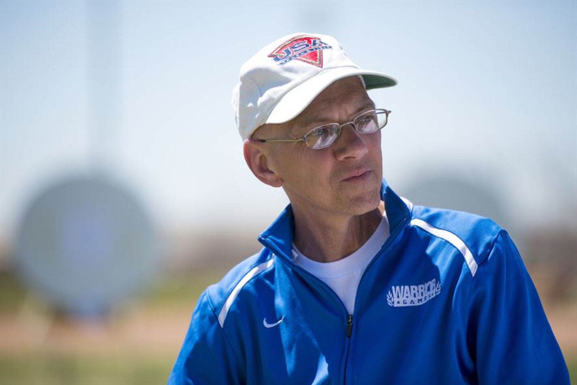 Retired Senior Master Sgt. Mike Sanders enjoys a moment of rest April 10, 2014, during the Air Force Trials at Nellis Air Force Base, Nevada. Sanders is a cancer survivor and an active participant in Air Force Wounded Warrior program. Sanders was told he was free of the disease in 2008 and has been using sports as part of his recovery process. (U.S. Air Force photo/Senior Airman Jette Carr)