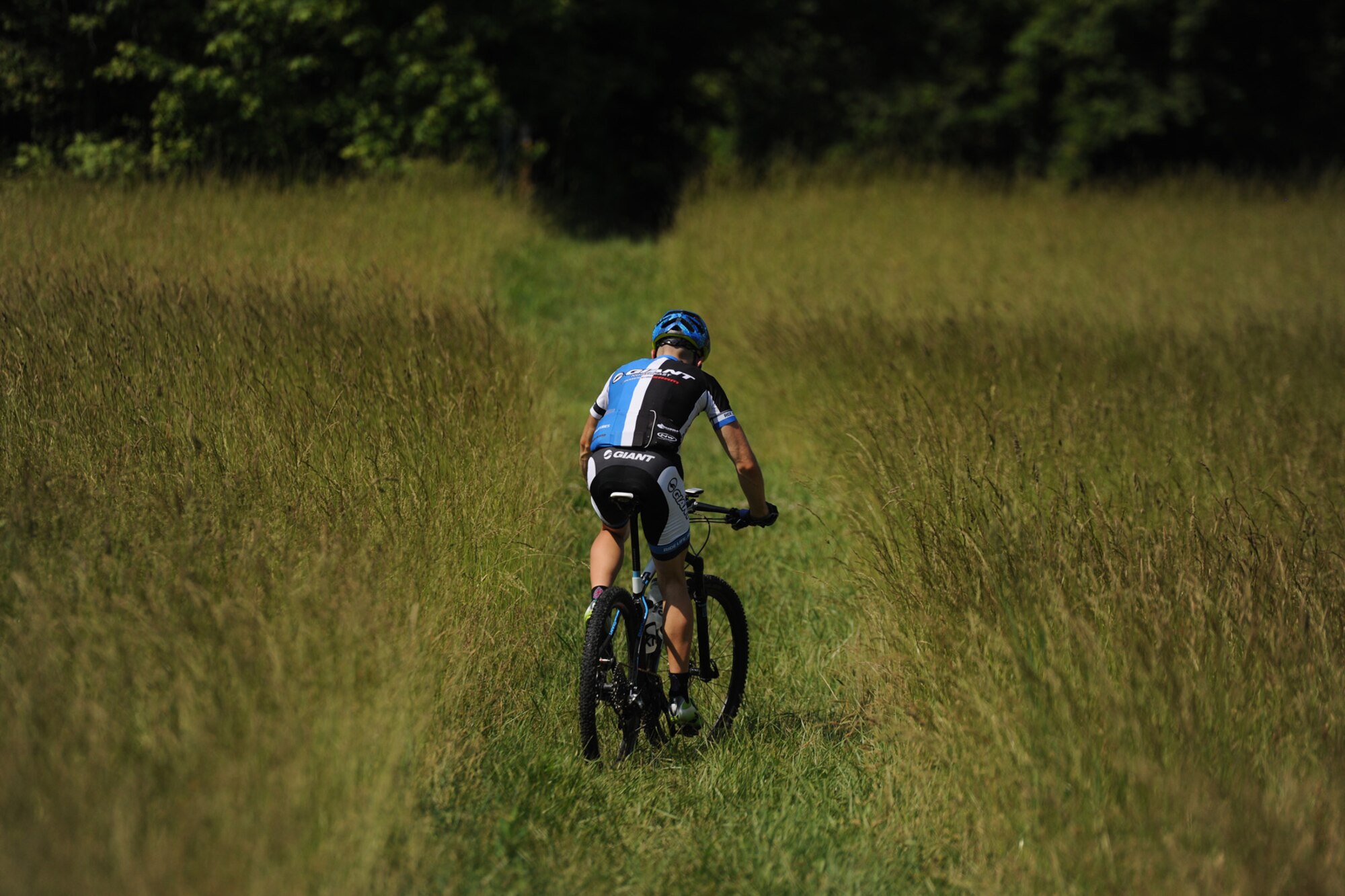 Senior Airman David Flaten, 811th Security Forces Squadron protective services member and professional cross-country mountain biker, trains at Rosaryville State Park, Md., June 3, 2014. Flaten is ranked 43rd of 250 according to USA Cycling, the official cycling organization responsible for identifying, training and selecting cyclists to represent the United States in international competition. (U.S. Air Force photo/ Senior Airman Nesha Humes)