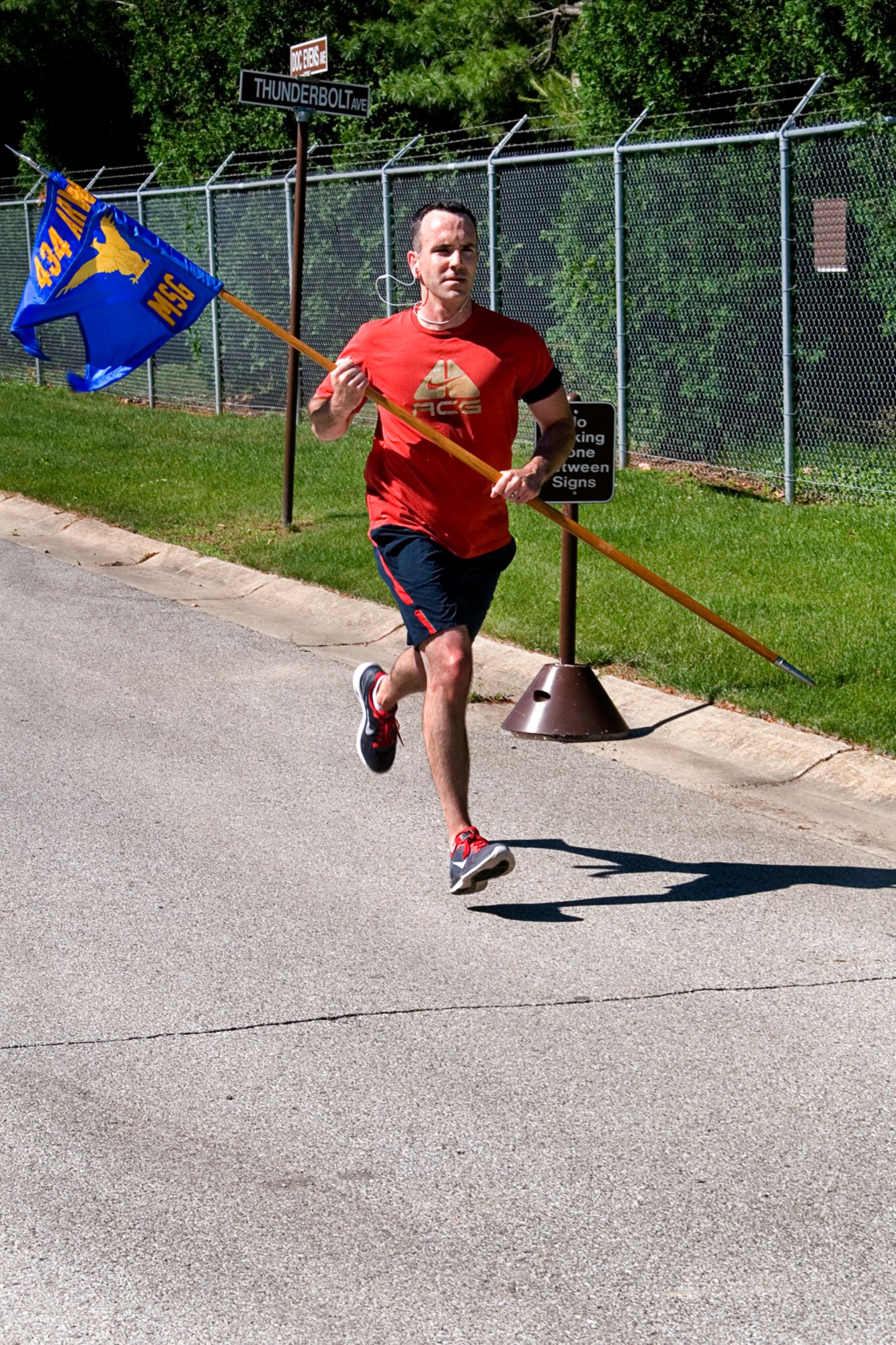 Jeremy McKissack, staff judge advocate, heads down the home stretch June 13, 2014 at Grissom Air Reserve Base, Ind., during a special flag run. The run was held to promote esprit de corps and promote physical fitness at the same time. (U.S. Air Force photo/ Tech. Sgt. Doug Hays)