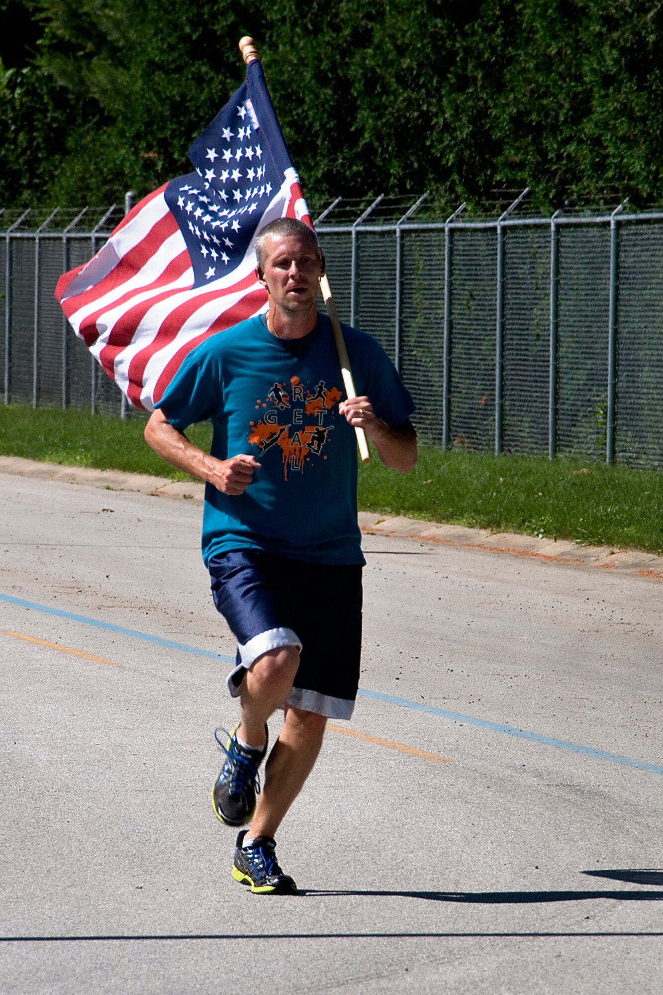Cory Walters, 434th Civil Engineer Squadron biological scientist, heads toward the finish line June 13, 2014 at Grissom Air Reserve Base, Ind., during a special flag run. The run was designed to promote esprit de corps and promote physical fitness. (U.S. Air Force photo/Tech. Sgt. Douglas Hays)