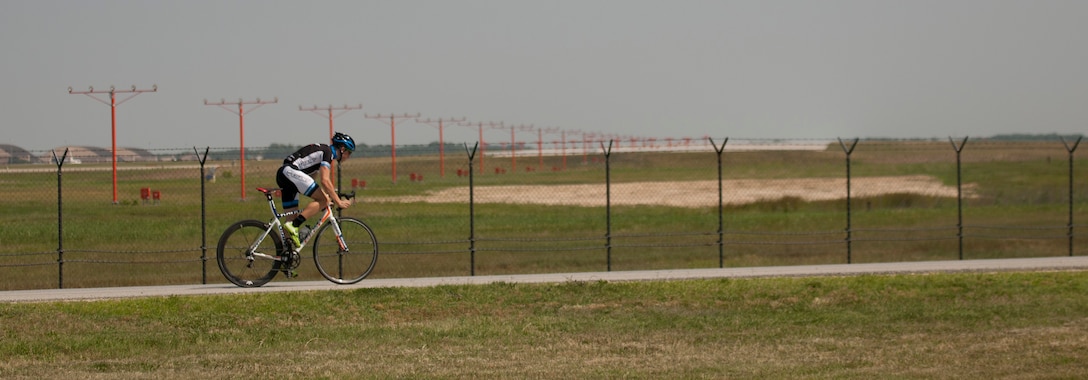 Senior Airman David Flaten, 811th Security Forces Squadron protective services member and professional cross-country mountain biker, trains at Joint Base Andrews, Md., June 18, 2014. Flaten is ranked 43rd of 250 according to USA Cycling, the official cycling organization responsible for identifying, training and selecting cyclists to represent the United States in international competition. (U.S. Air Force photo/ Senior Airman Nesha Humes)