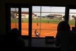 A scorekeeper watches as private softball teams from the Air Force Audit Agency and 435th Fighter Training Squadron warm up for a game June 12 at Joint Base San Antonio-Randolph. (U.S. Air Force photo by Airman 1st Class Alexandria Slade)