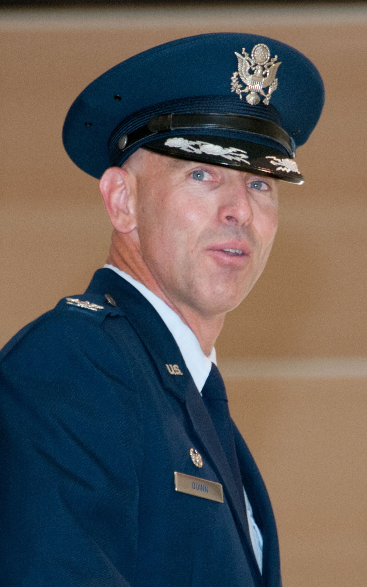 : VANCE AIR FORCE BASE, Okla. -- Col. Clark J. Quinn, the 71st Flying Training Wing commander, addresses the members of Team Vance during his first speech as commander June 18 at Hanger 199 during a change-of-command ceremony. Quinn assumed command from Col. Darren V. James, who is leaving Vance for Scott Air Force Base, Illinois. Gen. Robin Rand, the Air Education and Training Command commander, presided over the ceremony. (U.S. Air Force photo/ Terry Wasson)