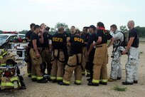 Firefighters from the Universal City Fire Department and the 502nd Civil Engineer Squadron receive feedback on their performance June 12. (U.S. Air Force photo by Desiree Palacios)