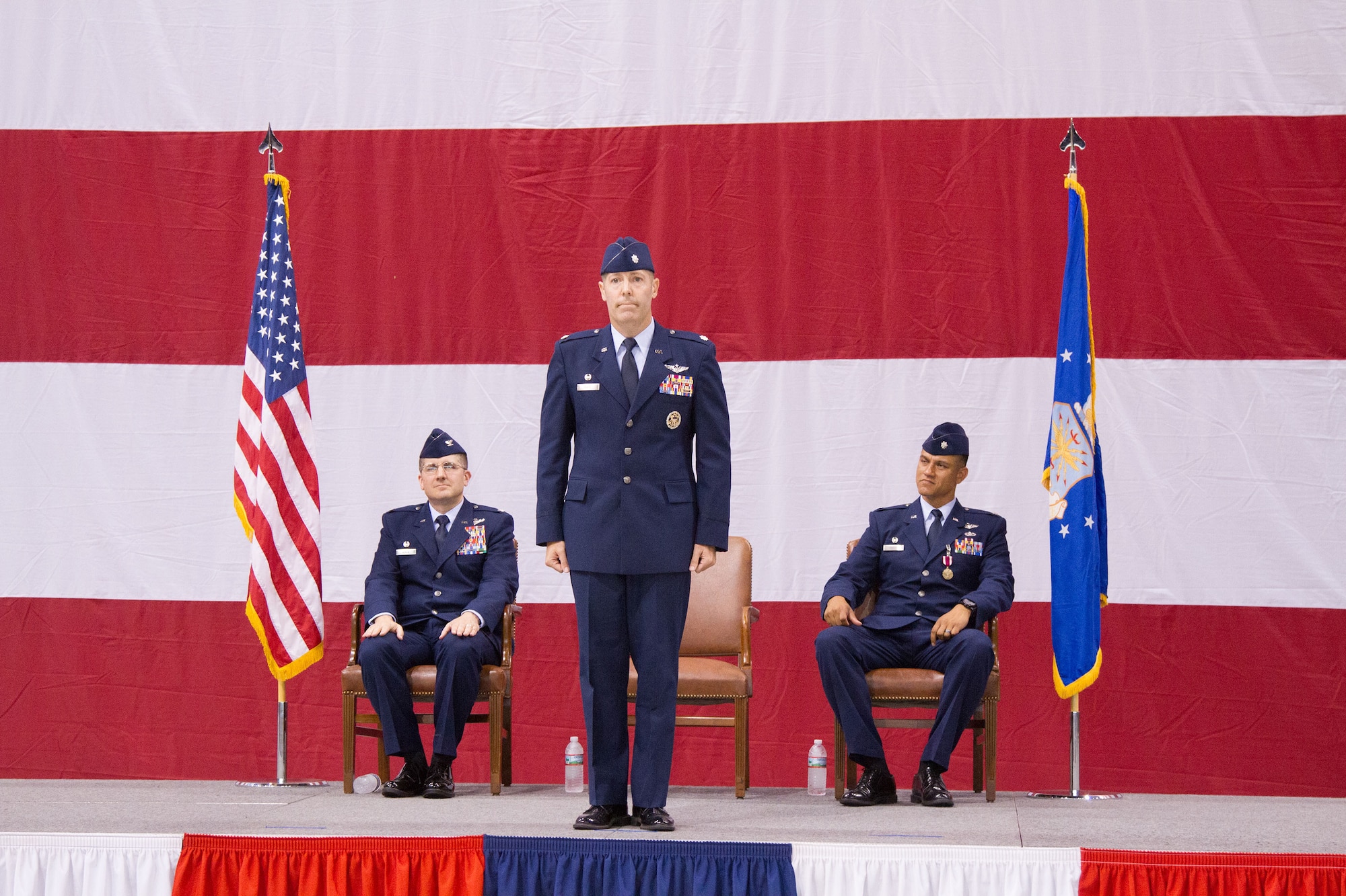 Lt. Col. Steven Tofte awaits his first salute shortly after assuming command of the 752nd Operations Support Squadron from Lt. Col. Anthony J. Owens, right. Colonel Tofte had previously served as director of operations for the 752nd OSS. Colonel Owens will be heading to Ramstein Air Base in Germany as a member of Headquarters United States Air Forces Europe. Col. Alexander Koven, 552nd Air Control Group commander, left, presided over the ceremony held June 6 in Bldg. 230, Dock 2, before a host of friends, family and fellow service members. (Air Force photo by Master Sgt. Thomas Edwards)