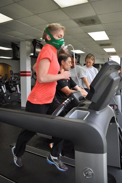 Col. Jeannie Leavitt, former 4th Fighter Wing commander, wears a mask to monitoring breathing while participating in a metabolic test at the base gym recently. Leavitt’s test was in conjunction with a visit from fitness specialist Paul Bengds, who focuses on tailoring exercise regiments to the needs of different individuals. (U.S. Air Force photo/Staff Sgt. Alan Abernethy)