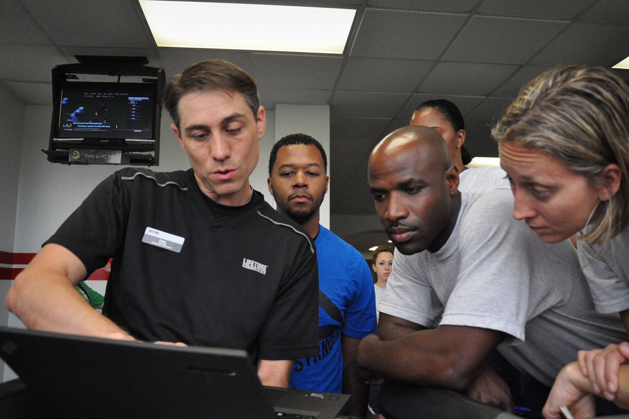 916th Air Refueling Wing Airmen learn ways to improve physical training efficiency from fitness specialist Paul Bengds, who recently visited the base gym. (U.S. Air Force photo/Staff Sgt. Alan Abernethy)