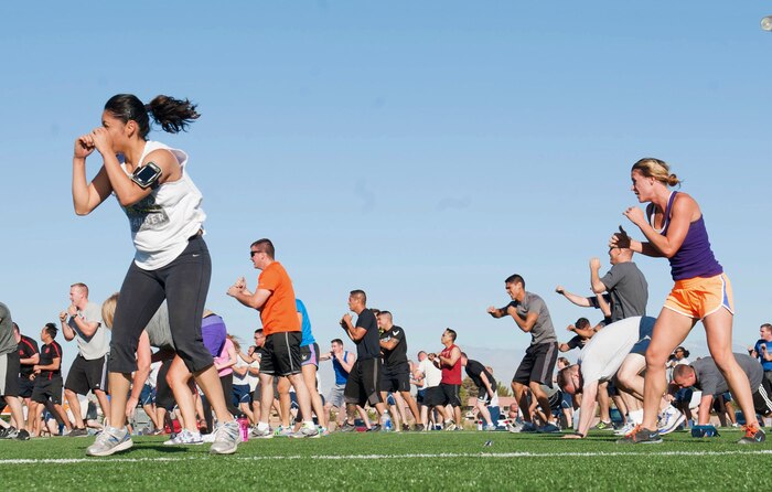 Members of the Nellis community perform boxing exercises during a Warrior Trained Fitness session with P90X workout creator Tony Horton, at the Warrior Fitness Center, June 17, 2014, Nellis Air Force Base, Nev. The boxing exercises were a part of the cardiovascular circuit to increase strength. (U.S. Air Force photo by Airman 1st class Rachel Loftis)