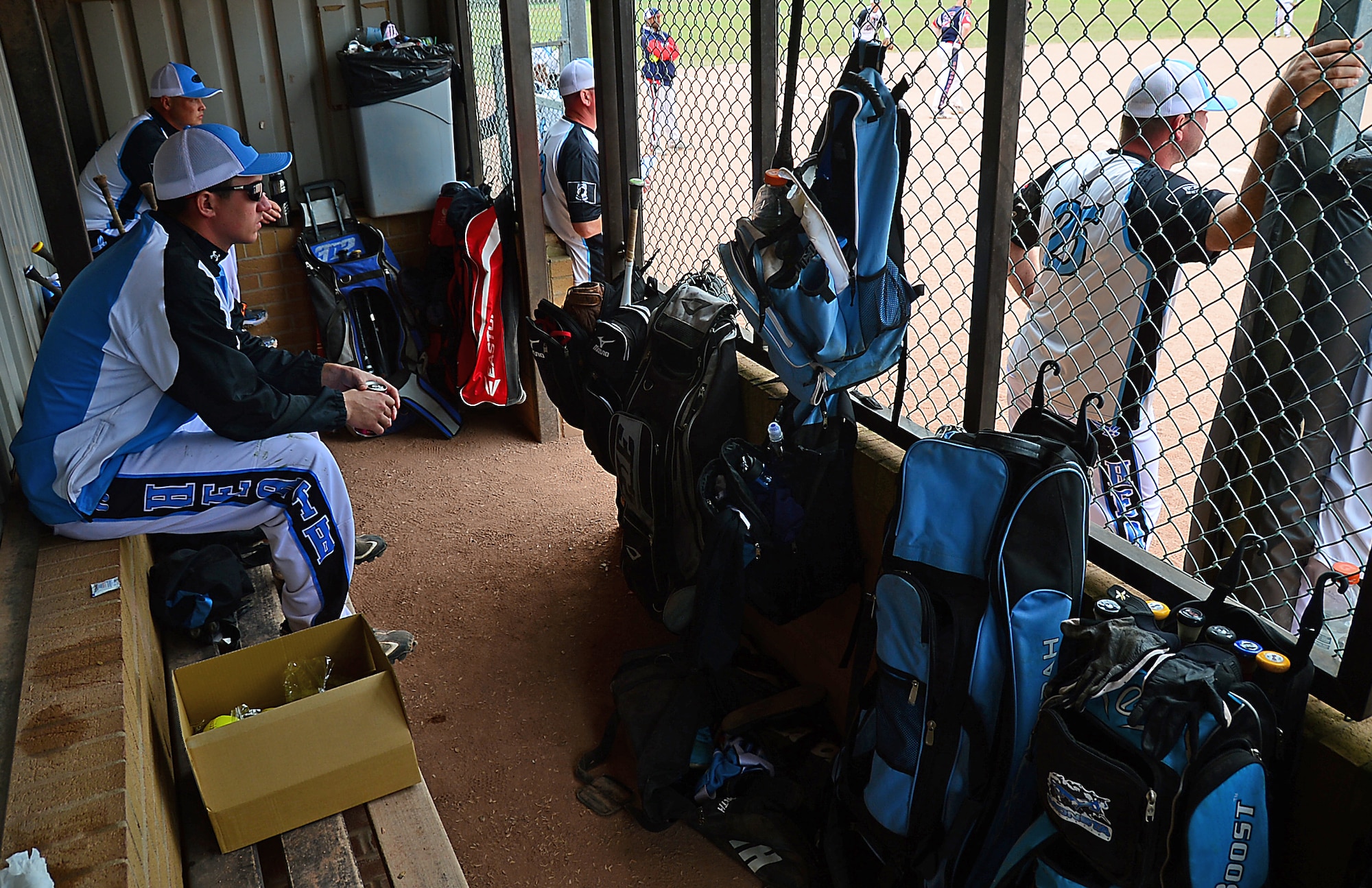 Royal Air Force Lakenheath teammates watch a game from the dug-out during the 3rd Annual U.S. Air Forces in Europe Softball Tournament held here, June 15, 2014. (U.S. Air Force photo by Airman 1st Class Erin O’Shea/Released)