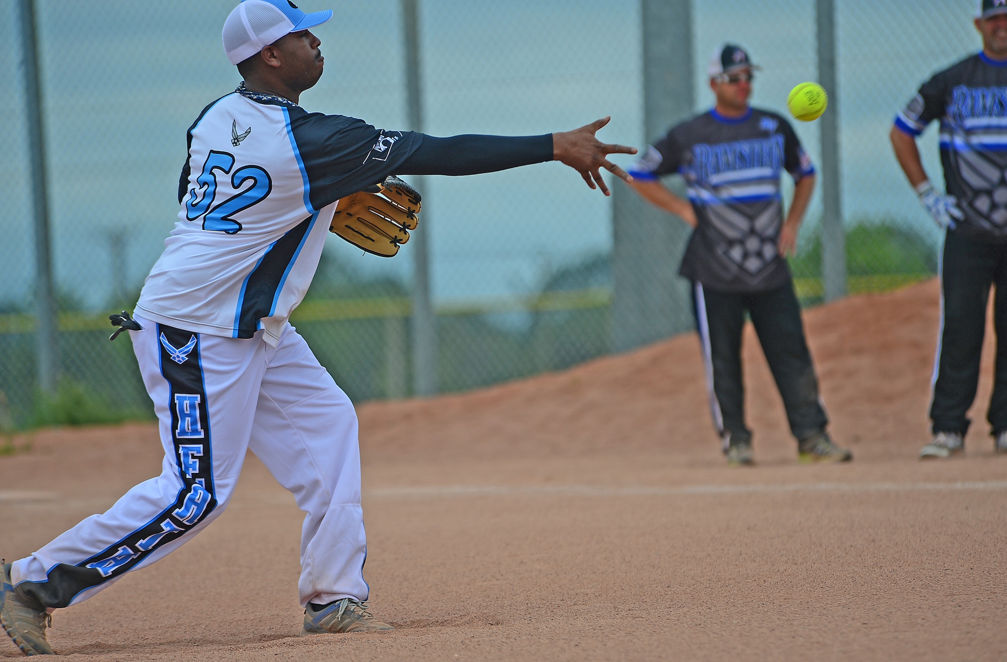 Sante McCleave pitches a softball during the 3rd Annual U.S. Air Forces in Europe Softball Tournament held at Royal Air Force Lakenheath, England, June 15, 2014. Ramstein Air Base defeated RAF Lakenheath with a final score of 21-20. McCleave is the superintendent of knowledge operations assigned to the 48th Communications Squadron. (U.S. Air Force photo by Airman 1st Class Erin O’Shea/Released)