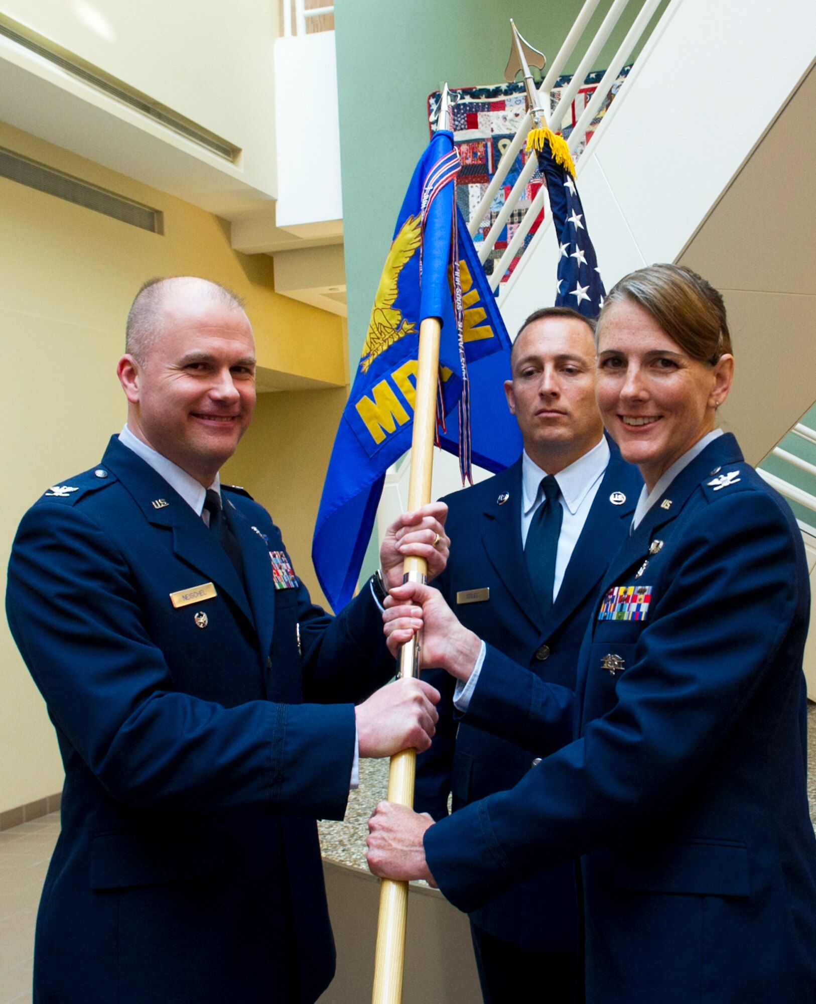 Col. Tasha Pravecek took the reins as commander of the 5th Medical Group from Col. William Tyra during a change of command ceremony, June 12, 2014. The 5th MDG offers outpatient services including Family Practice, Dental, Pediatrics, Internal Medicine, Aerospace Medicine, Physical Therapy, Optometry and Women's Health Care. The group consists of the 5th Medical Operations Squadron and 5th Medical Support Squadron. (U.S. Air Force photo/Senior Airman Brittany Y. Bateman)