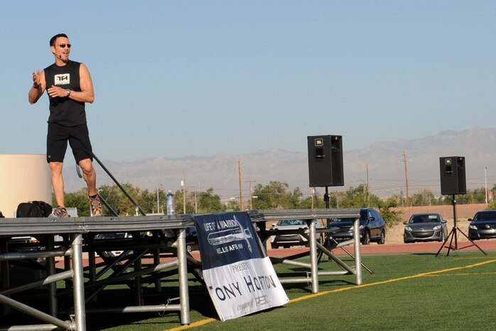 Tony Horton, creator of the P90X workout, leads a Warrior Trained Fitness event at the Warrior Fitness Center June 17, 2014, at Nellis Air Force Base, Nev. After leading the group workout, Horton spoke to Airmen at the base theater about believing in themselves and leading a healthy lifestyle. (U.S. Air Force photo by Tech. Sgt. Taylor Worley)