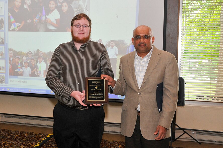 The American Institute of Aeronautics and Astronautics (AIAA) Tennessee Section recently held an annual awards luncheon where professional engineers were recognized for their significant technical accomplishments, outstanding achievements and support to AIAA Section activities. Dexter Watkins (left), a member of the Vanderbilt University Aerospace Club, receives the AIAA Special Award for sustained and outstanding achievement in aerospace engineering, as evidenced by winning the overall championship of the NASA University Space Launch Initiative. He receives the award from Vanderbilt University Faculty Advisor and Professor Amrutur Anilkumar.