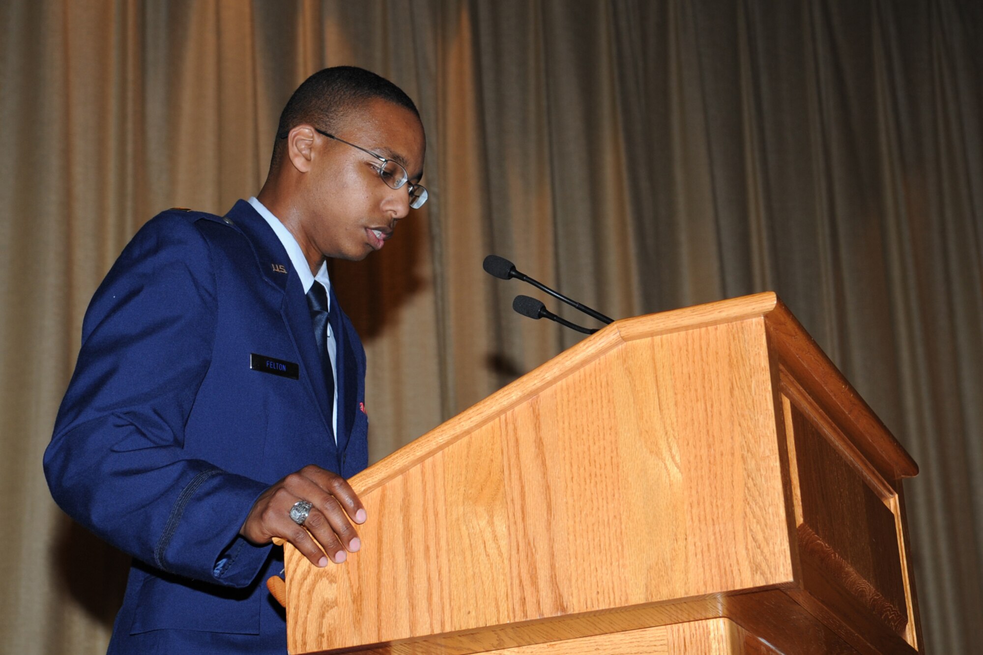 GOODFELLOW AIR FORCE BASE, Texas -- Second Lt. Colby E. Felton, Air Force Reserve Command chaplain candidate, gives an invocation during a Stars and Stripes ceremony at the base theater here May 30. Chaplain candidates preach, provide invocations, plan and execute events, give briefings, engage units and attend meetings. (U.S. Air Force photo/ Staff Sgt. Laura R. McFarlane)
