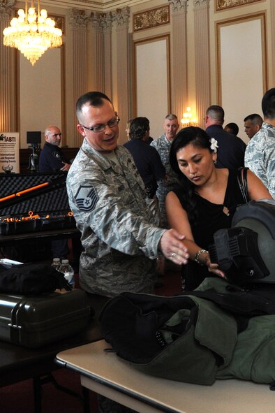 Master Sgt. Scott Baker explains elements of an explosive ordnance disposal bomb suit during EOD Day on the Hill in Washington June 12, 2014. EOD Day on the Hill is an annual event designed to stress the importance of preserving the EOD force structure, funding the baseline EOD budget and keeping the faith with EOD servicemembers. Baker is the 11th Civil Engineer Squadron EOD Flight superintendent assigned to Joint Base Andrews, Maryland. (U.S. Air Force photo/Master Sgt. Tammie) 