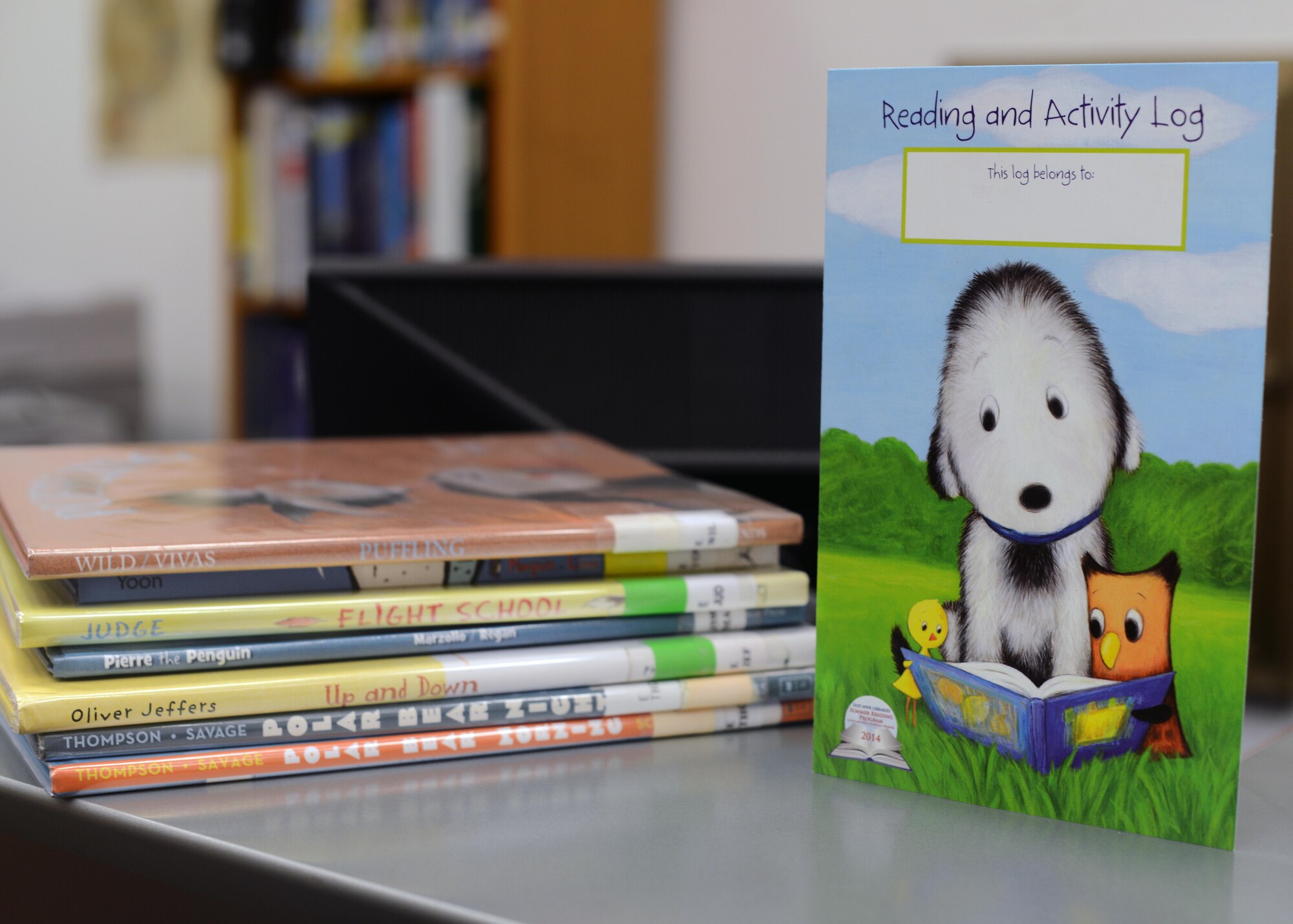 “Paws to Read,” a summer reading program, is an Air Force-wide initiative for Airmen and their family’s to continue reading throughout the summer. The Aviano Base Library offers logs to children and adults to track their hours throughout the seven- week program.  (U.S. Air Force photo/Airman 1st Class Deana Heitzman)