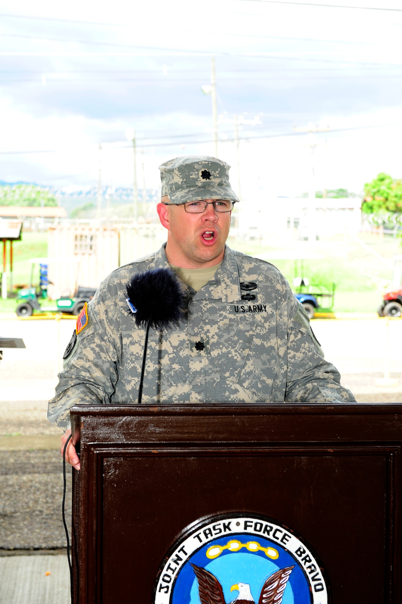 U. S. Army Lt. Col. Nicholas Dickson assumes command of the Army Forces Battalion at Soto Cano Air Base, Honduras by accepting the guidon from U. S. Army Col. Thomas Boccardi, the Joint Task Force-Bravo commander, June 16, 2014. Nicholson assumed command from outgoing commander U. S. Army Lt. Col. Alan McKewan. Army Forces Battalion is an expeditionary force ready to deploy as a resilient, integrated team capable of conducting administrative and logistical support for Joint Task Force-Bravo missions within Central America in order to counter illicit trafficking, support foreign humanitarian assistance/disaster relief and build partner nation capacity.  (Photo by Martin Chahin)