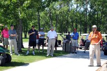 Stan Bruggeman, Plainsview Golf Course manager, reads some ground rules before the Military Affairs Committee golf tournament on Grand Forks Air Force Base, N.D., June 17, 2014. The tournament brought together military and civilian leaders in friendly competition to build relationships between the base and community. (U.S. Air Force photo/Staff Sgt. Dobrydney)