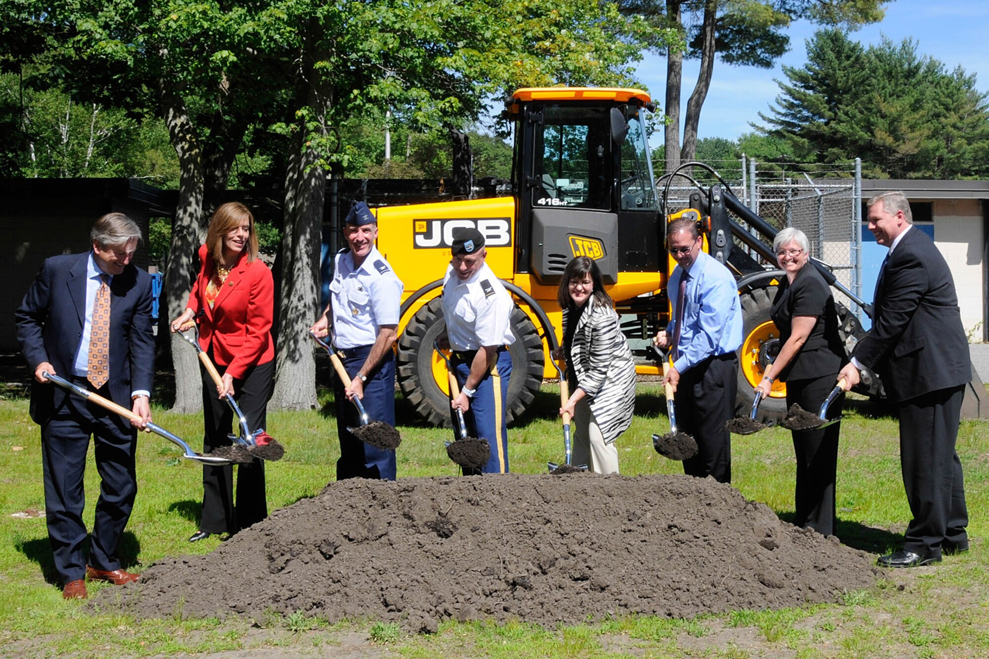 HANSCOM AIR FORCE BASE, Mass. – (From left to right) U.S. Congressman John Tierney; U.S. Congresswoman Katherine Clark; Col. Lester Weilacher, 66th Air Base Group commander; Col. Charles Samaris, Army Corps of Engineers New England District commander; Jennifer Glass, Lincoln School Committee chair; Jonathan Braley, J&J Contractors president; Doctor Rebecca Mcfall, Lincoln Public Schools superintendent and Erich Ledebuhr, Hanscom Middle School principal, break ground on the site of Hanscom's new $34 million middle school on June 16.

The new school is expected to include both indoor and outdoor learning areas, a science technology engineering (art) math-enabled classroom and an integrated building system, which will house solar panels and rainwater harvesting that can be used for teaching. (U.S. Air Force photo by Linda LaBonte Britt).
