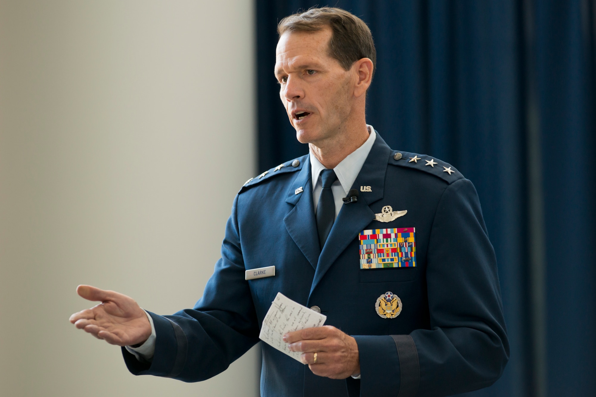 Lt. Gen. Stanley E. Clarke III, the director of the Air National Guard delivers his welcome remarks during an assumption of command ceremony at the Air National Guard Readiness Center, June 16, 2014, Joint Base Andrews, Md. Brig. Gen. Michael R. Taheri, commander of the ANGRC assumes command from Lt. Gen. Clarke. The ANGRC ensures ANG field units are properly resourced to train and equip in support of the state and federal missions across the entire spectrum of military operations and provide support sustaining ANG Airmen throughout their careers. (Air National Guard photo by Master Sgt. Marvin Preston/Released)
