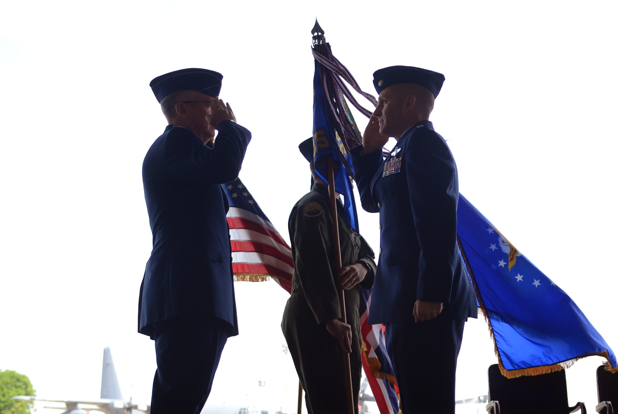 U.S. Air Force Col. Matt Powell, left, 352nd Special Operations Group commander, renders a salute to  U.S. Air Force Lt. Col. Roy Oberhaus, incoming 7th Special Operations Squadron commander, during the 7th SOS change of command ceremony June 13, 2014, on RAF Mildenhall, England. U.S. Air Force Lt. Col. William Freeman relinquished command to Oberhaus. (U.S. Air Force photo/Airman 1st Class Dillon Johnston/Released)
