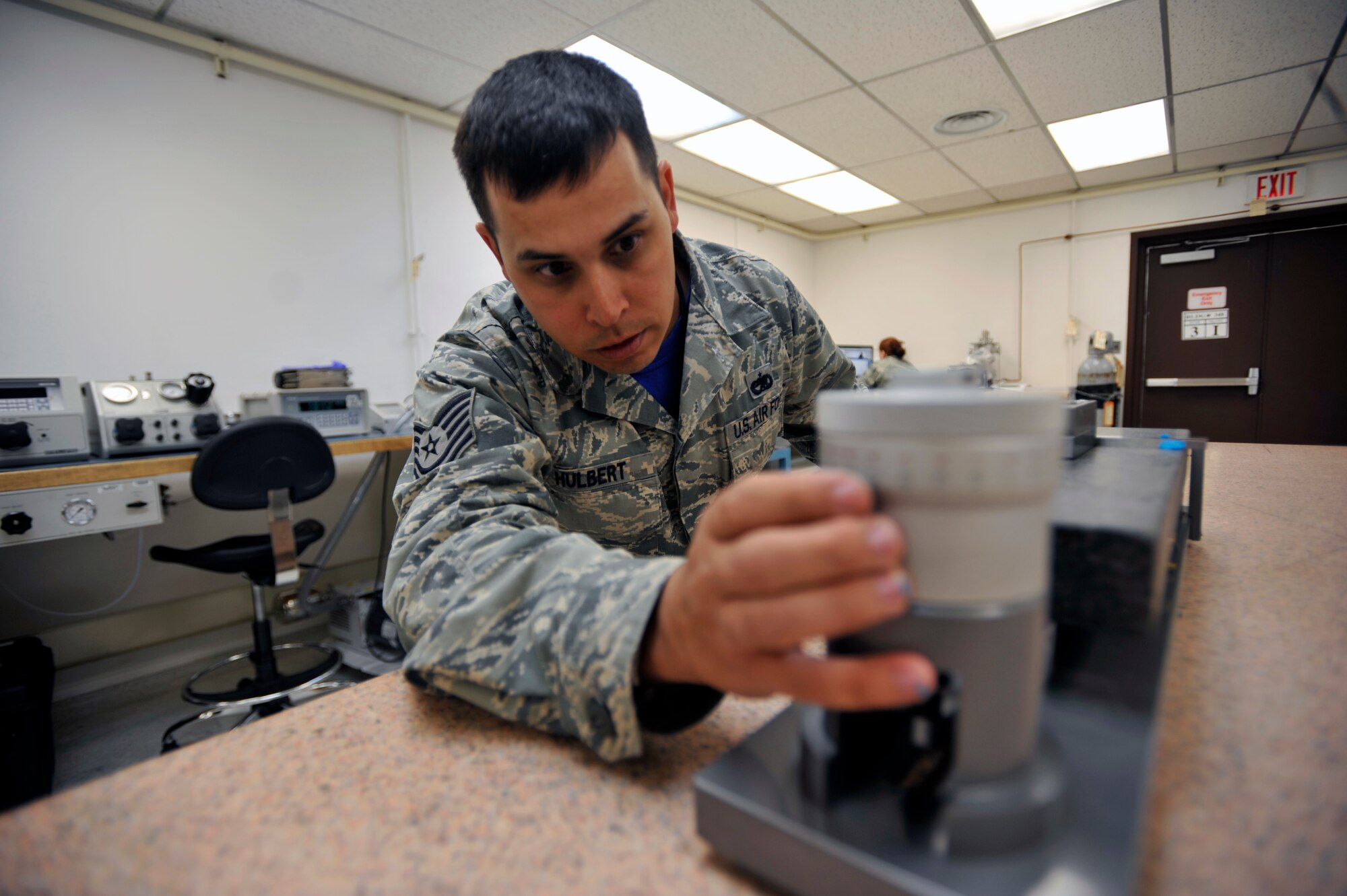 Tech. Sgt. Josh Hulbert, 51st Maintenance Squadron precision measurement equipment laboratory section supervisor, calibrates a precision level using a small angle generator on Osan Air Base, Republic of Korea, June 6, 2014. A small angle generator is used for obtaining precisely known small angular deflections, allowing users to calibrate their own equipment. (U.S. Air Force photo/Senior Airman David Owsianka)