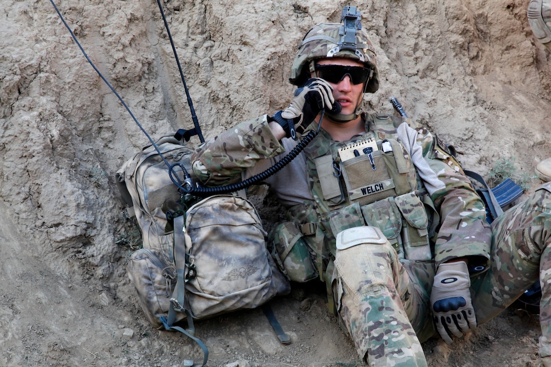 U.S. Army Spc. Colby Welch conducts a radio check inside an abandoned fortress in Petawa village in Afghanistan's Parwan province, June 13, 2014. Welch is assigned to the 101st Airborne Division's Company A, 1st Battalion, 2nd Brigade Combat Team, Task Force Strike.