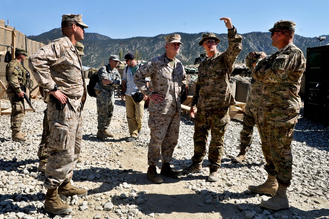 U.S. Marine Corps Gen. John R. Allen, commander of U.S. and international forces in Afghanistan, meets with U.S. and Afghan soldiers and police during his battlefield circulation to Regional Command East in Afghanistan's Paktika province, Sept. 26, 2011. During his visit, Allen ate lunch with the troops and thanked them for their service and commitment.  
