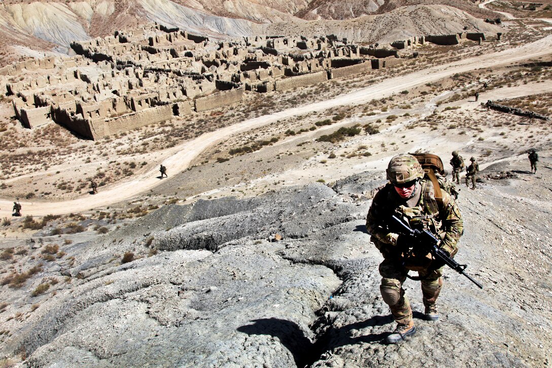 U.S. Army soldiers and Afghan border patrolmen walk up a mountainside while providing security during a patrol outside Forward Operating Base Curry in Paktika province, Afghanistan, Sept. 20, 2011. The soldiers arre assigned to Company B, 172nd Infantry Brigade.  
