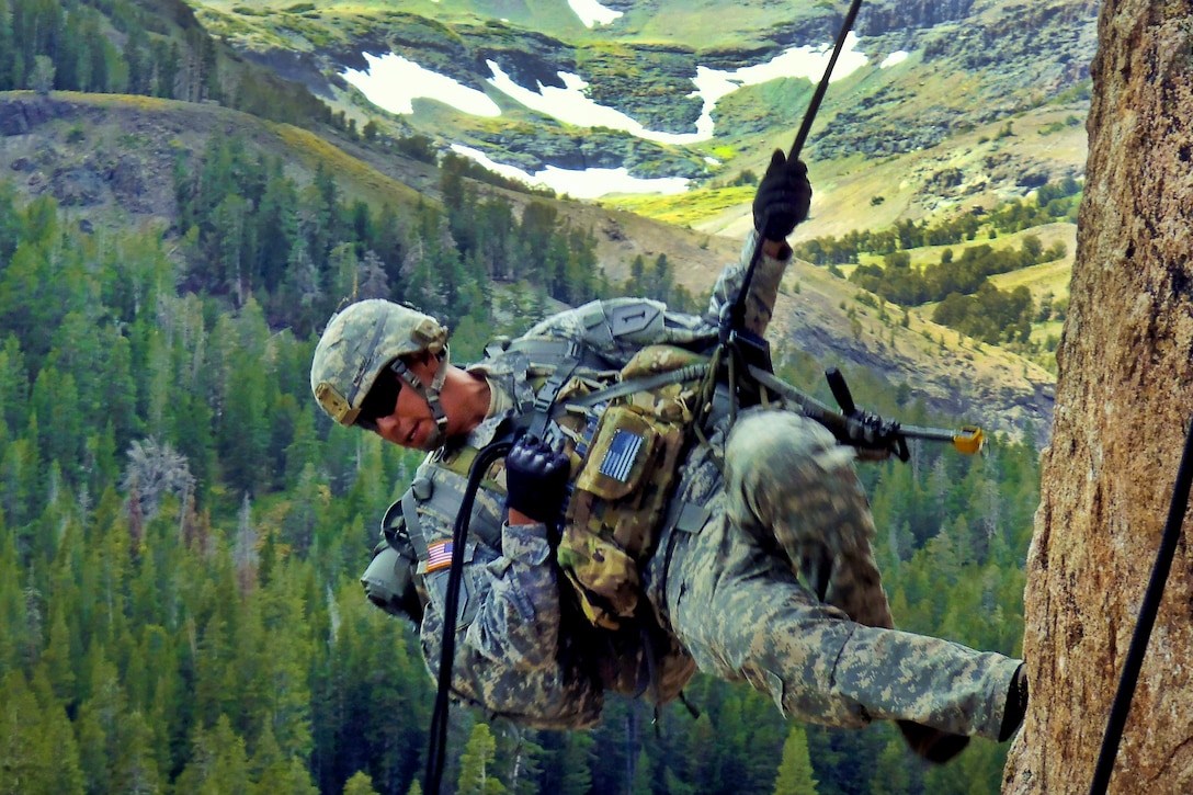 Army Cpl. Jose Pacheco practices rappelling techniques during Mountain Exercise 08-11 at the Marine Corps Mountain Warfare Training Center in Northern California's Toiyabe National Forest, Sept. 22, 2011. Pacheco is assigned to the 1st Infantry Division's Headquarters Company, 1st Battalion, 28th Infantry Regiment, 4th Infantry Brigade Combat Team.  
