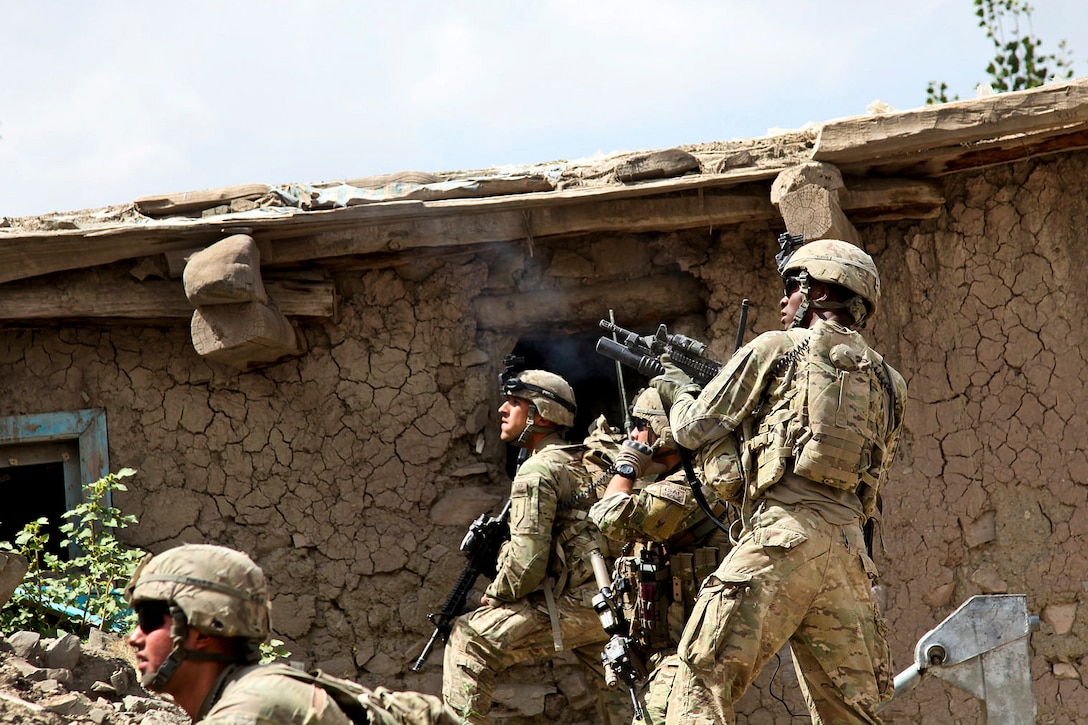 U.S. soldiers fire at an enemy hiding position during Operation Tofan 2 in Suri Khel, Afghanistan, Sept. 16, 2011. Soldiers worked to clear insurgents from the town and prevent their return. The soldiers are assigned to 6th Squadron, 4th Cavalry Regiment, 3rd Brigade Combat Team.  

