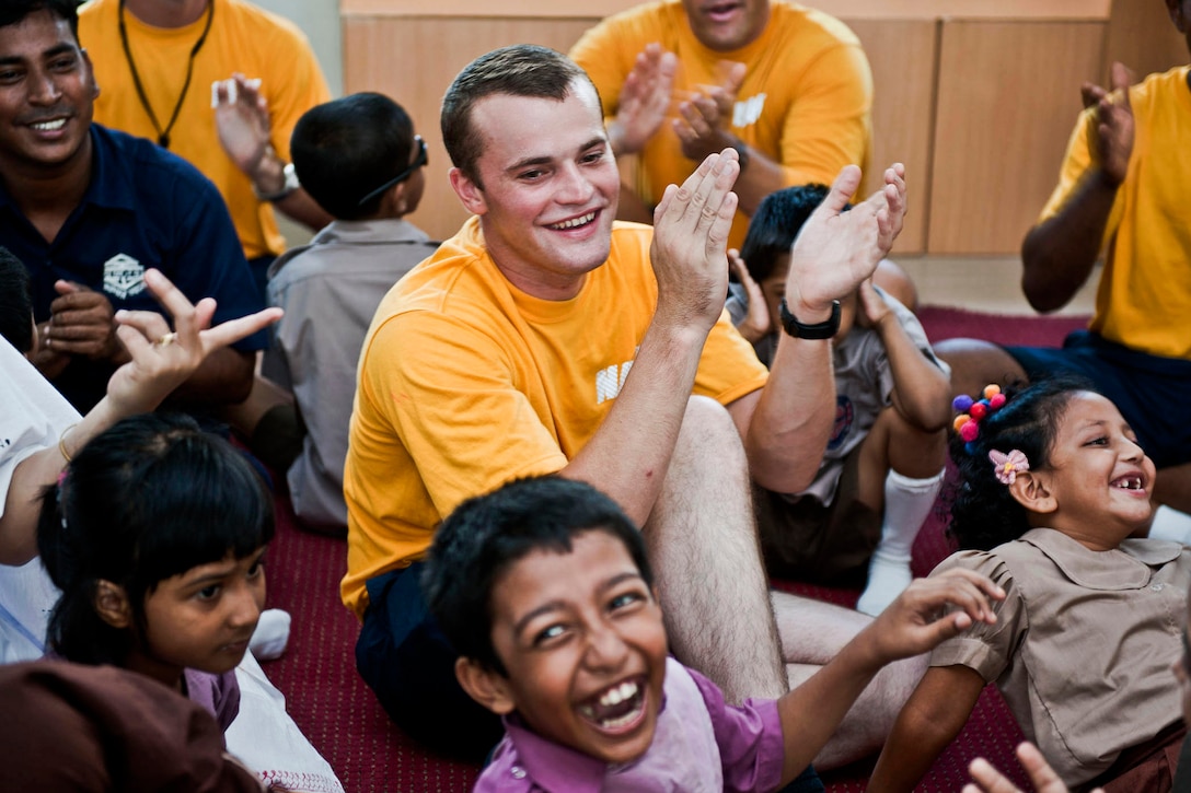 U.S. Navy Petty Officer 3rd Class Ian Vroman participates in a music class at the Bangladesh Ashar Alo School and Rehabilitation Center in Chittagong, Bangladesh, Sept. 20, 2011. Vroman is participating in Cooperation Afloat Readiness and Training Bangladesh 2011, a series of bilateral exercises held annually in Southeast Asia to strengthen relationships and enhance force readiness. Bangladesh has joined the exercise for the first time. 
