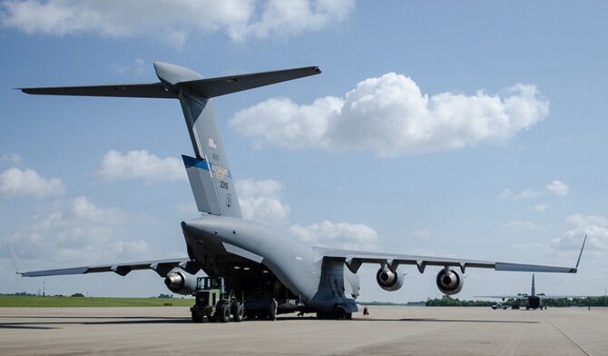 Airmen from the Kentucky Air National Guard’s 123rd Contingency Response Group offload cargo from a Mississippi Air National Guard C-17 Globemaster during Capstone '14, a homeland earthquake-response exercise at Fort Campbell, Ky., on June 17, 2014. The 123rd CRG is joining with the U.S. Army’s 688th Rapid Port Opening Element to operate a Joint Task Force-Port Opening here from June 16 to 19, 2014. (U.S. Air National Guard photo by Master Sgt. Phil Speck)