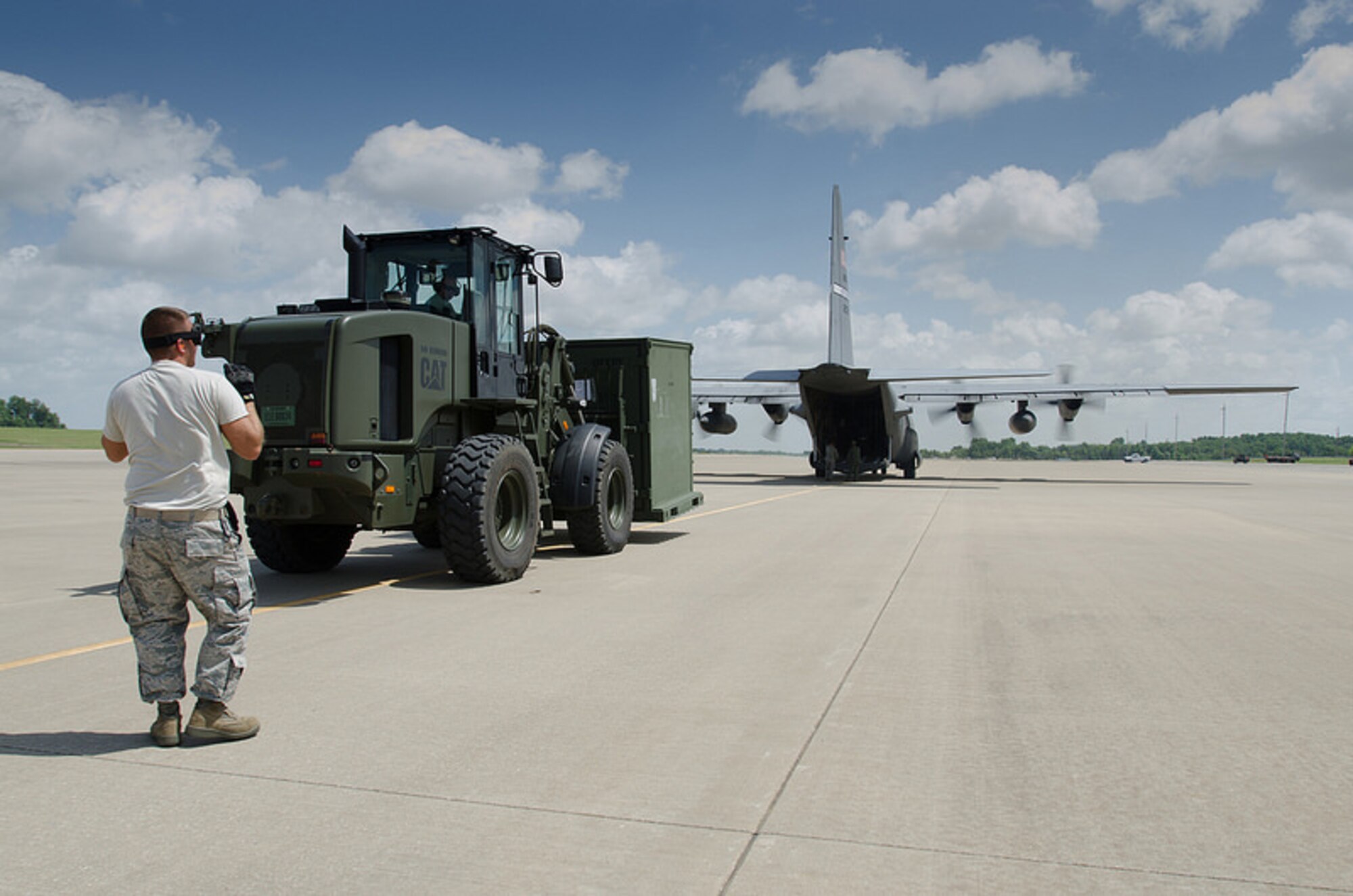 Airmen from the Kentucky Air National Guard’s 123rd Contingency Response Group unload a Kentucky Air Guard C-130 Hercules during Capstone '14, a homeland earthquake-response exercise at Fort Campbell, Ky., on June 17, 2014. The 123rd CRG is joining with the U.S. Army’s 688th Rapid Port Opening Element to operate a Joint Task Force-Port Opening here from June 16 to 19, 2014. (U.S. Air National Guard photo by Master Sgt. Phil Speck)