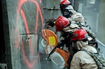 Missouri National Guard Soldiers exit a decontamination tent during a Region 7 Homeland Response Force exercise at Muscatatuck Urban Training Center near Butlerville, Ind., March 23, 2012. More than 500 Missouri National Guard Soldiers and Airmen participated in the exercise, which evaluates their ability to react to large-scale disasters within the U.S.