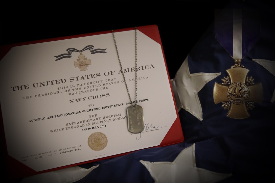 Gunnery Sgt. Jonathan Gifford was posthumously awarded the Navy Cross, the highest decoration bestowed by the Department of the Navy and second highest decoration for valor, during a ceremony at Stone Bay aboard Marine Corps Base Camp Lejeune, June 17. 

General John M. Paxton, Jr., the assistant commandant of the Marine Corps, and Maj. Gen. Mark A. Clark, commanding general, U.S. Marine Corps Forces Special Operations Command, spoke during the ceremony and then presented the award to Gifford’s wife and children. 

“Acts of extraordinary heroism, those of conspicuous gallantry, are acts that cannot be planned, ordered or demanded. They are acts given fully and willingly by a person without regard to themselves; they are acts done for the man to their left, and the man to their right and for the mission” said Clark. “Today we are here to honor such a man.”