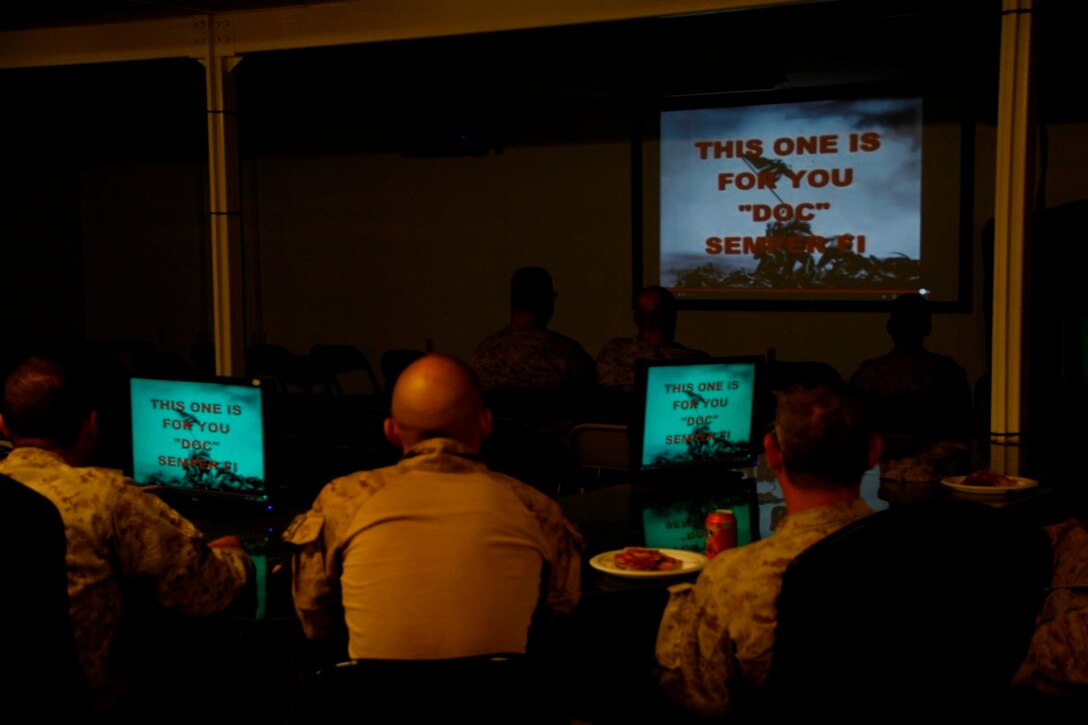 Sailors with Regional Command (Southwest) watch a documentary on the history of the U.S. Navy Hospital Corpsman aboard Camp Leatherneck, Helmand province, Afghanistan, June 13, 2014. Leading up to the 116th anniversary of the Hospital Corpsman on June 17, 2014, the corpsmen also participated in a 3-mile motivational run to pay tribute to those men and women who paved the way for today's generation of corpsmen.