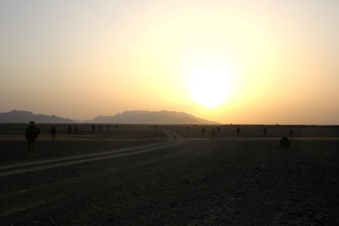 Marines with Bravo Company, 1st Battalion, 7th Marine Regiment, maneuver into a village as the run rises in Helmand province, Afghanistan, June 5, 2014. The company conducted disruption operations in a known Taliban bed-down location for two days. During the previous mission May 29, the company discovered a drug production lab and removed more than one metric ton of narcotics from the battlefield.
(U.S. Marine Corps photo by Cpl. Joseph Scanlan / released)
