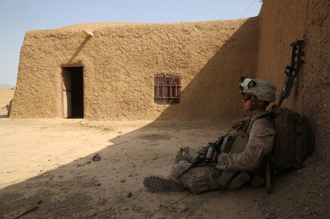 Lance Cpl. Patrick Durphy, a combat engineer attached with Bravo Company, 1st Battalion, 7th Marine Regiment, recuperates in the shade during a security patrol in Helmand province, Afghanistan, June 5, 2014. The company conducted disruption operations in a known Taliban bed-down location for two days. During the previous mission May 29, the company discovered a drug production lab and removed more than one metric ton of narcotics from the battlefield.
(U.S. Marine Corps photo by Cpl. Joseph Scanlan / released)
