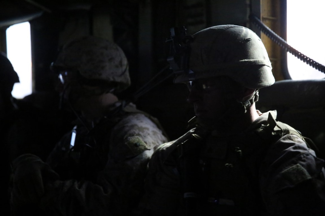 Corporal Bryce Bowman, a team leader with Bravo Company, 1st Battalion, 7th Marine Regiment, and a native of Lake of the Ozarks, Missouri, waits anxiously inside a CH-53E Super Stallion with Marine Heavy Helicopter Squadron 466 while being transported to an objective during a mission in Helmand province, Afghanistan, June 5, 2014. The company conducted disruption operations in a known Taliban bed-down location for two days. During the previous mission May 29, the company discovered a drug production lab and removed more than one metric ton of narcotics from the battlefield.
(U.S. Marine Corps photo by Cpl. Joseph Scanlan / released)
