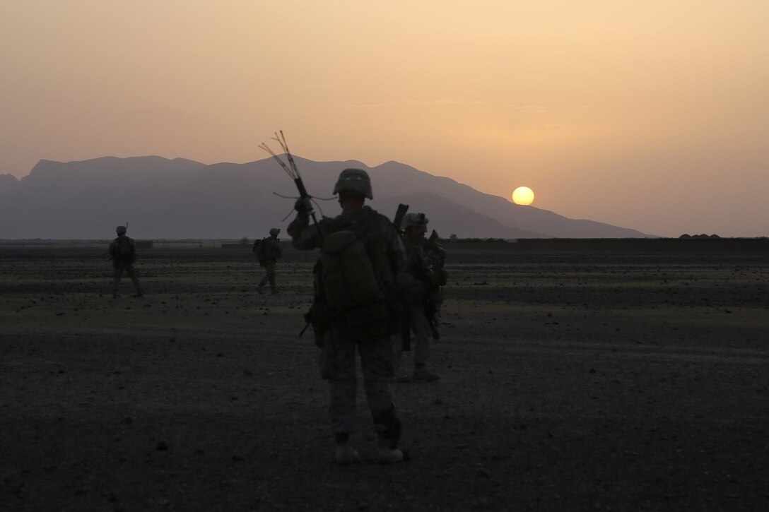 Marines with Bravo Company, 1st Battalion, 7th Marine Regiment, maneuver into a village as the run rises in Helmand province, Afghanistan, June 5, 2014. The company conducted disruption operations in a known Taliban bed-down location for two days. During the previous mission May 29, the company discovered a drug production lab and removed more than one metric ton of narcotics from the battlefield.
(U.S. Marine Corps photo by Cpl. Joseph Scanlan / released)

