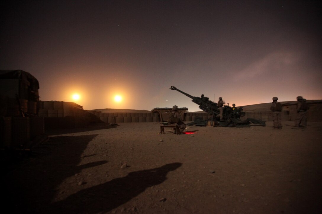 Marines with the Cannons Platoon of Tango Battery, 5th Battalion, 11th Marine Regiment, observe illumination rounds shot from their M777A2 Howitzer during a fire mission aboard Camp Bastion, Afghanistan, June 13, 2014. The Marines of Tango Battery aboard Camps Bastion and Leatherneck have a unique makeup for an artillery battery, with one platoon of M777A2 Howitzer cannons and one platoon of HIMARS launchers. (U.S. Marine Corps Photo By: Sgt. Frances Johnson/Released)