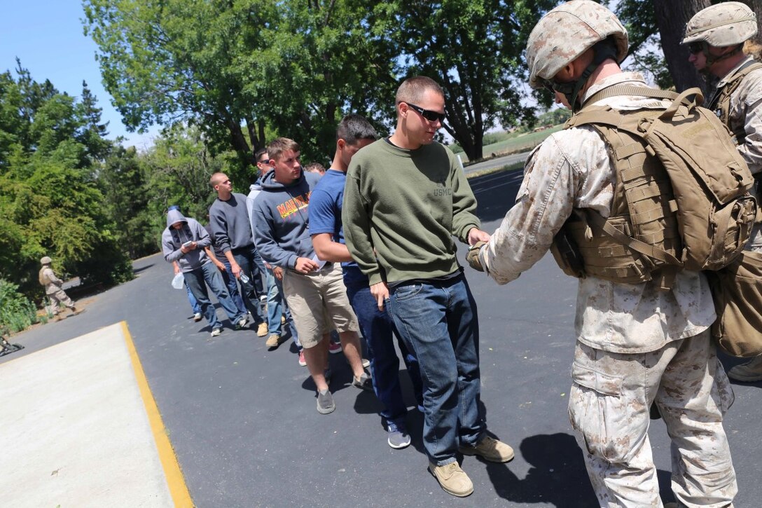 Marines with Fox Company, Battalion Landing Team 2nd Battalion, 1st Marines, 11th Marine Expeditionary Unit, conduct a non-combatant evacuation operation at San Louis Obispo, California, as part of Certification Exercise (CERTEX) June 15, 2014. CERTEX is comprised of a specific series of missions intended to evaluate and certify the 11th MEU for their upcoming deployment with the Makin Island Amphibious Ready Group scheduled for later this summer.(U.S. Marine Corps photo by Cpl. Demetrius Morgan/RELEASED)
