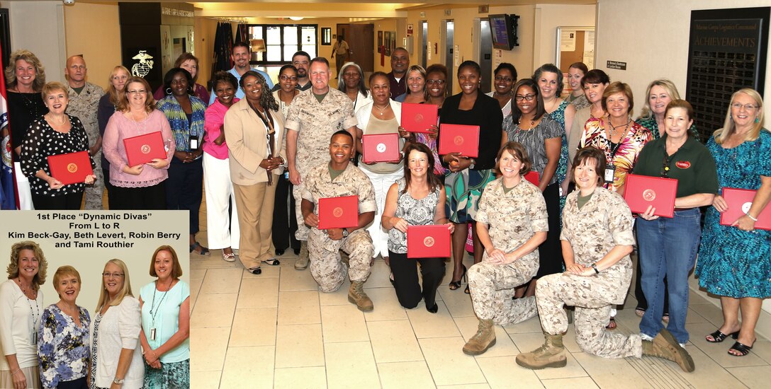 Participants in a weight loss challenge display their certificates of achievement with Maj. Gen. John J. Broadmeadow, commanding general, Marine Corps Logistics Command (center), at LOGCOM’s Headquarters, Building 3700, June 3. 